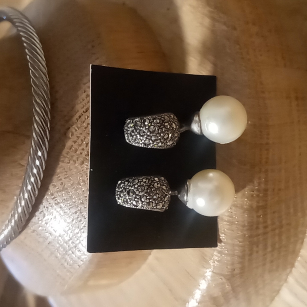 Faux pearls on 925 sterling silver.